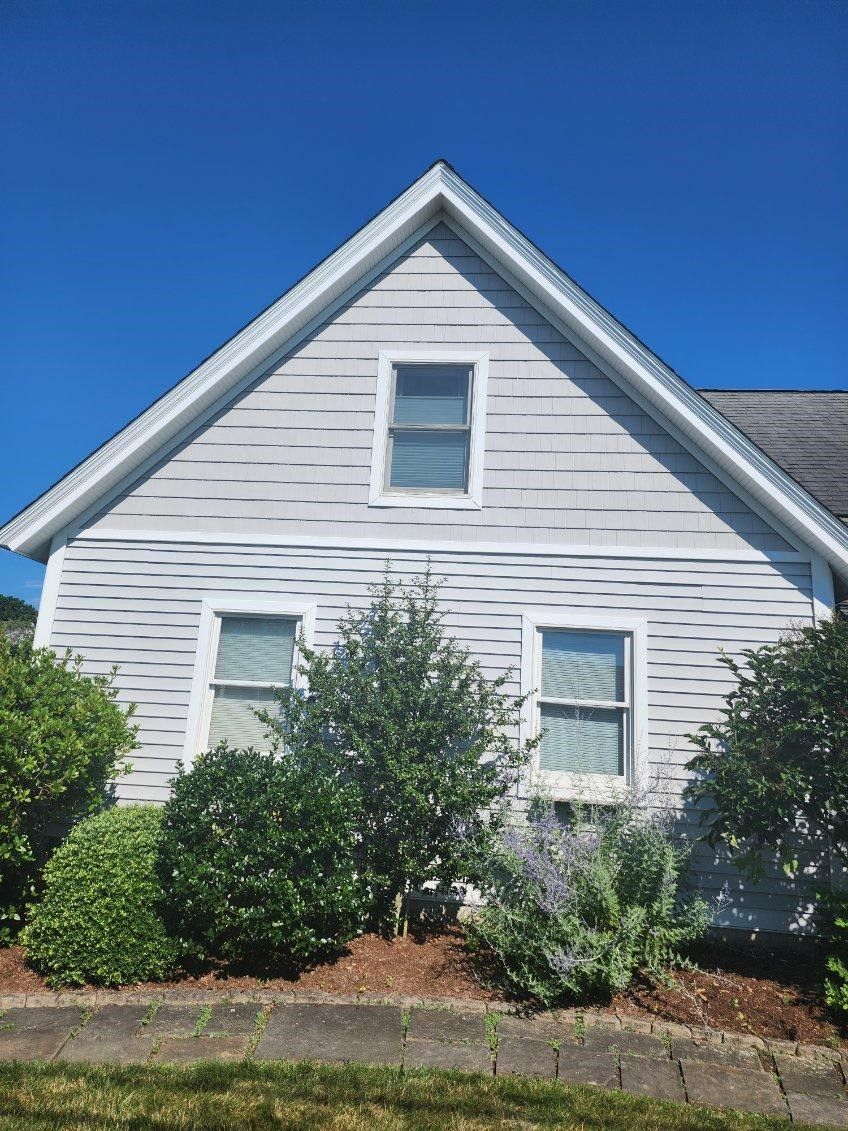 A white house with a blue sky in the background