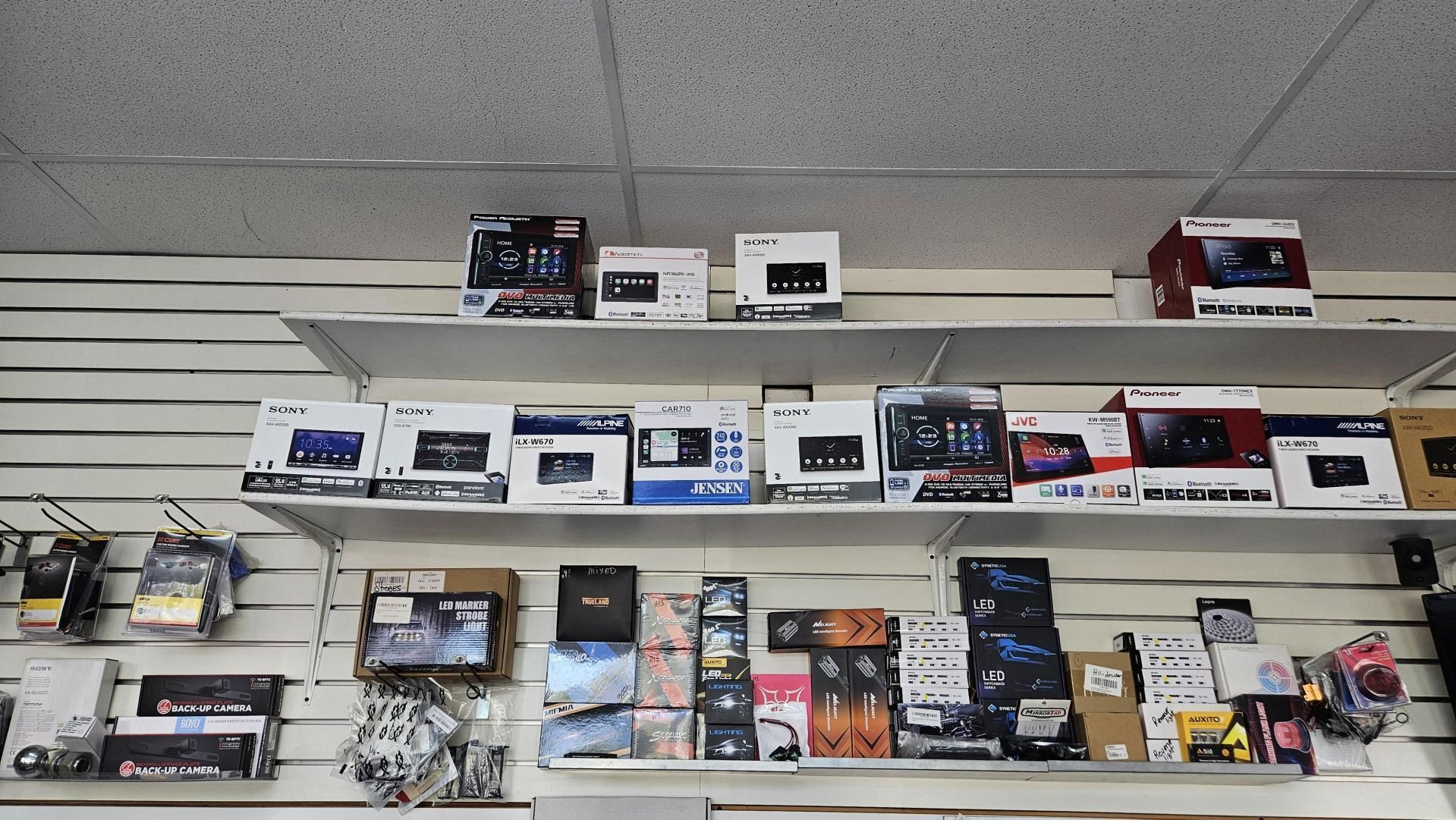 A store shelf filled with a variety of electronics