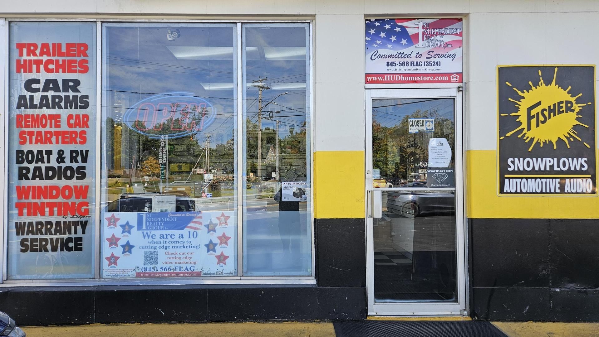 A store front with a sign that says fisher on it