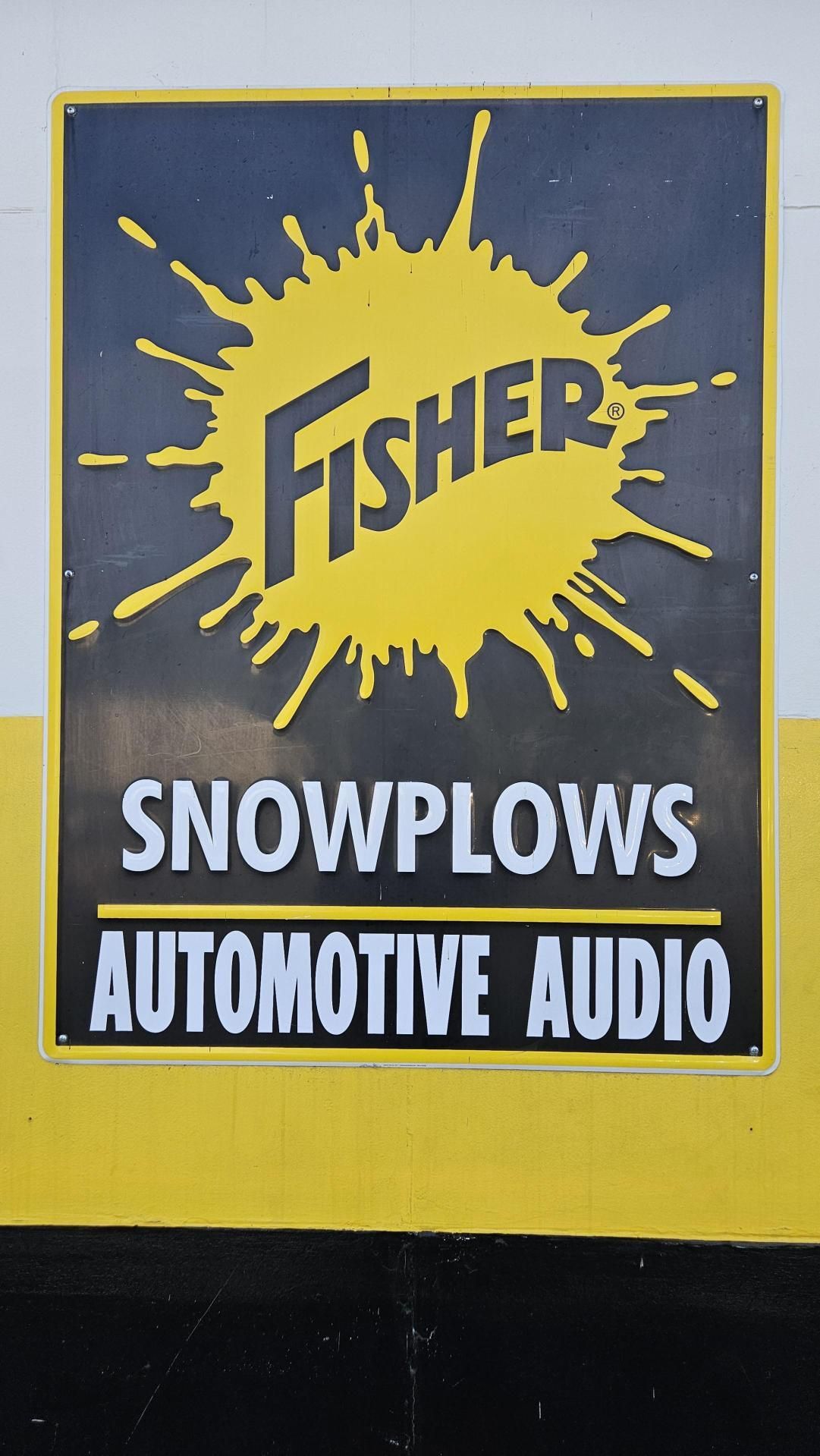 Fisher snowplows automotive audio sign on a wall