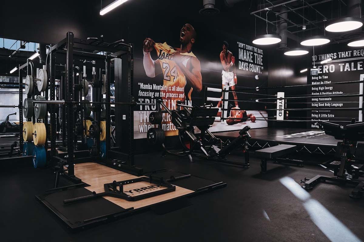 A gym with a picture of kobe bryant on the wall.