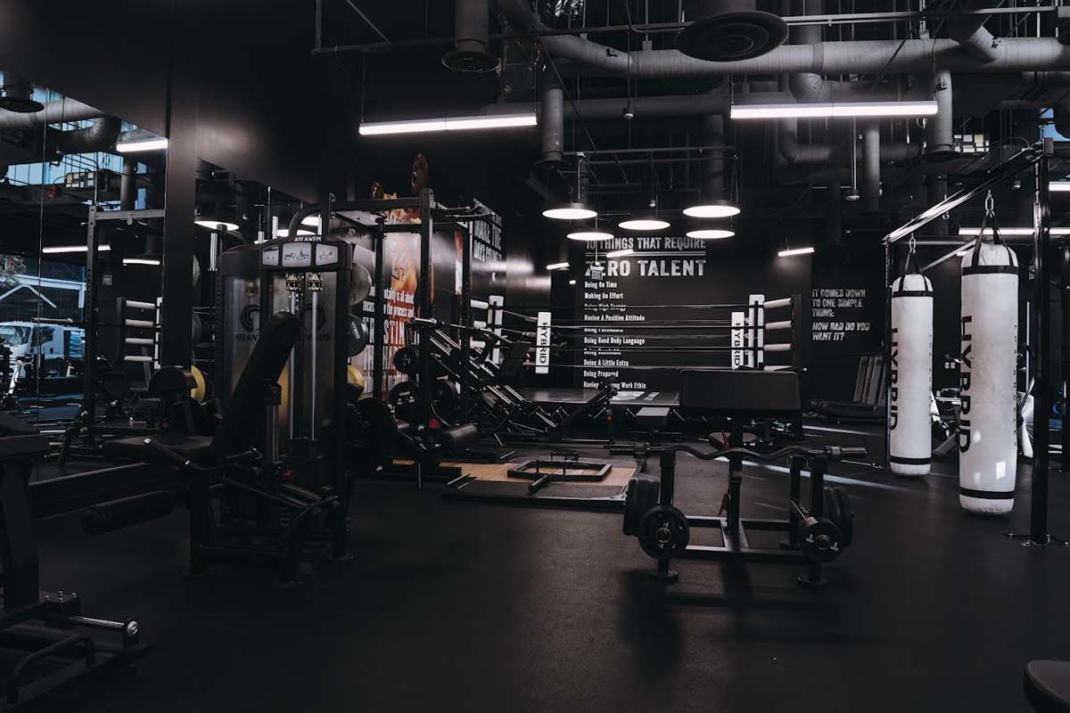 There is a boxing ring in the middle of the gym.