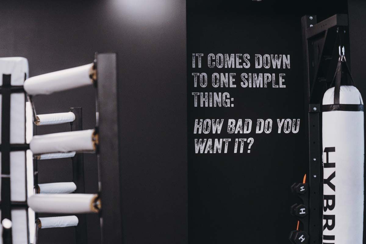 A gym with a sign that says it comes down to one simple thing