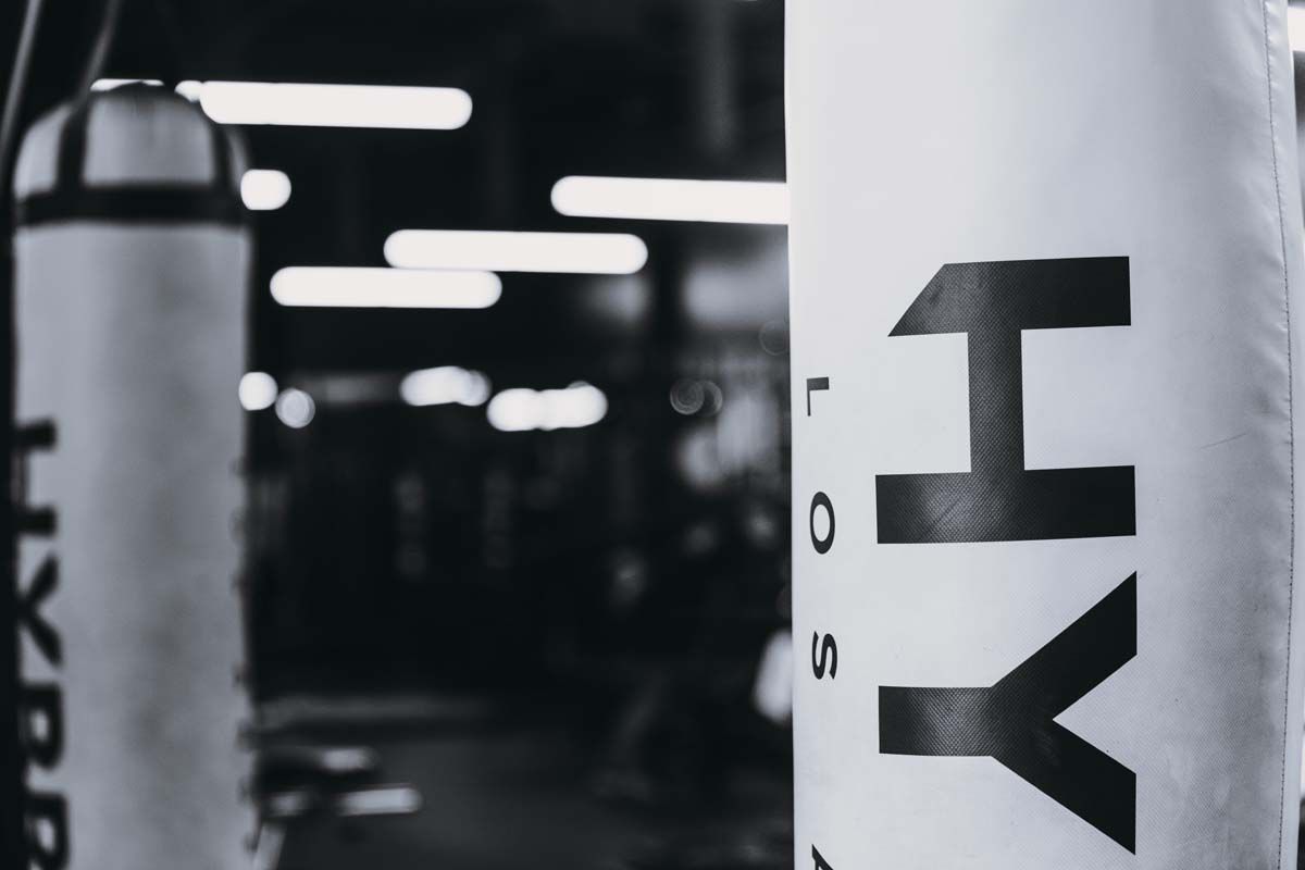 A black and white photo of a boxing bag with the word hy on it