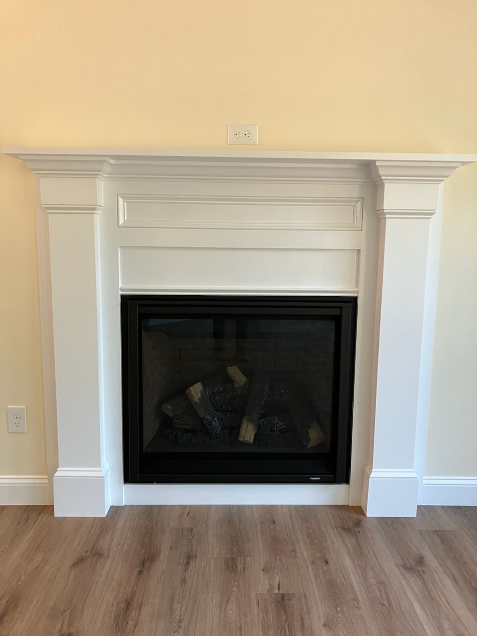 There is a fireplace in the middle of the room.