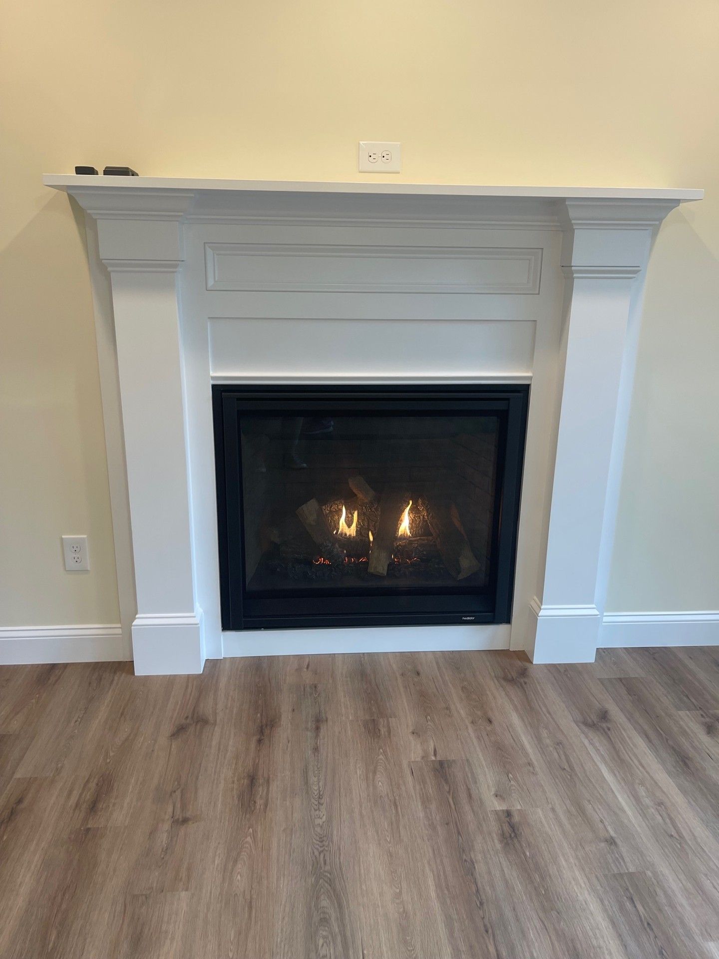 There is a fireplace in the middle of the room.