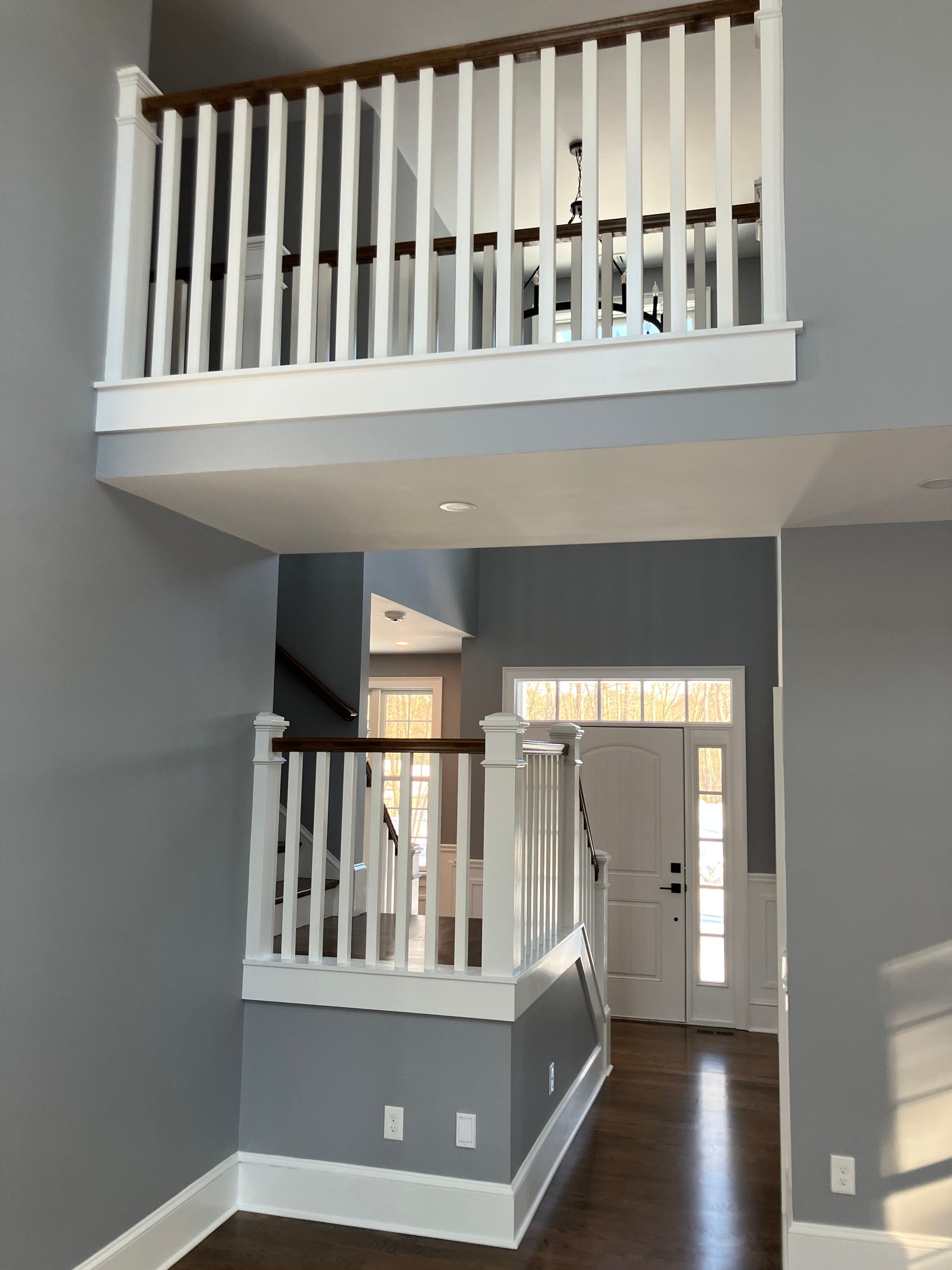 An empty house with a balcony and stairs