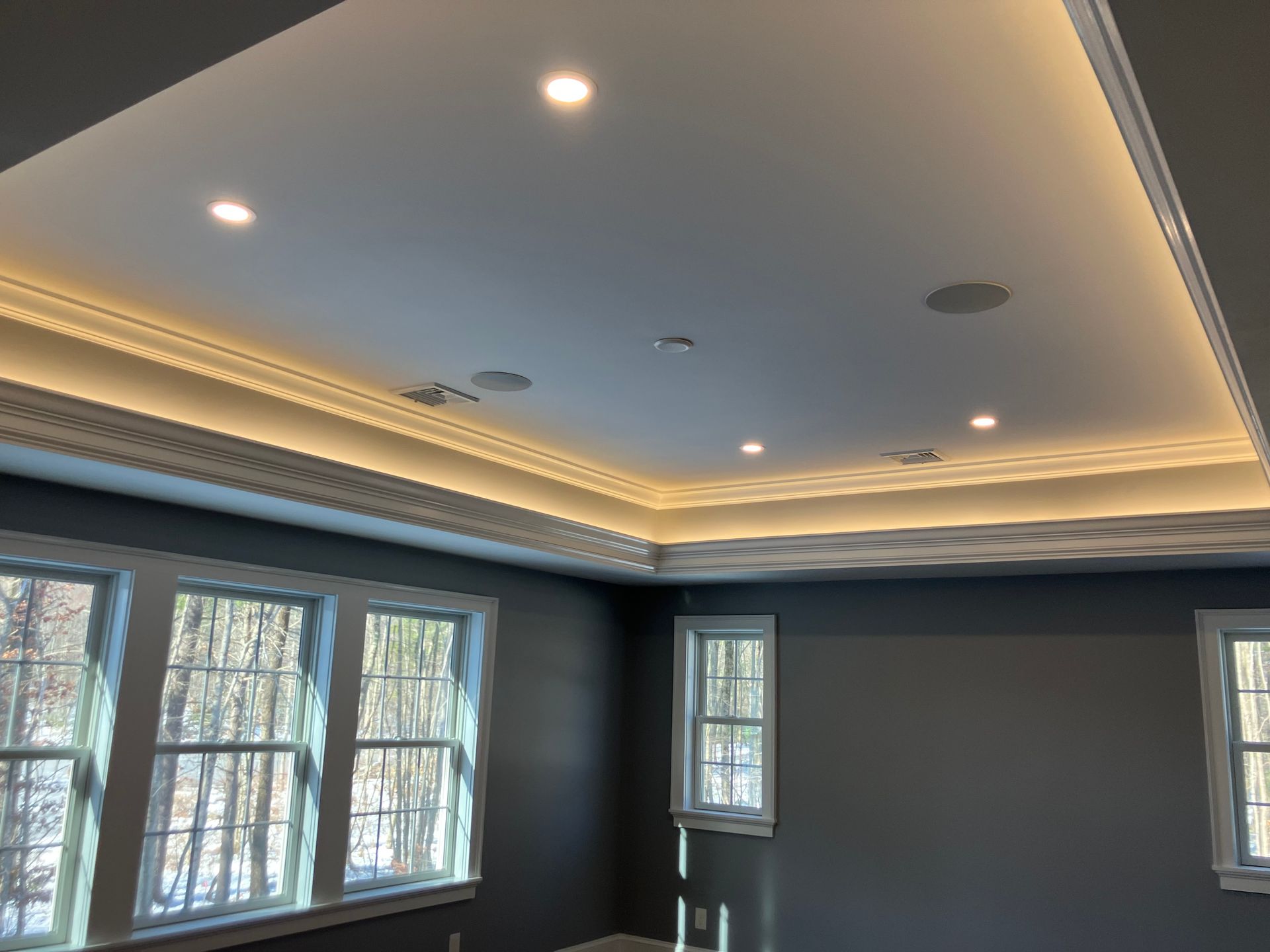 A room with a ceiling and a lot of windows