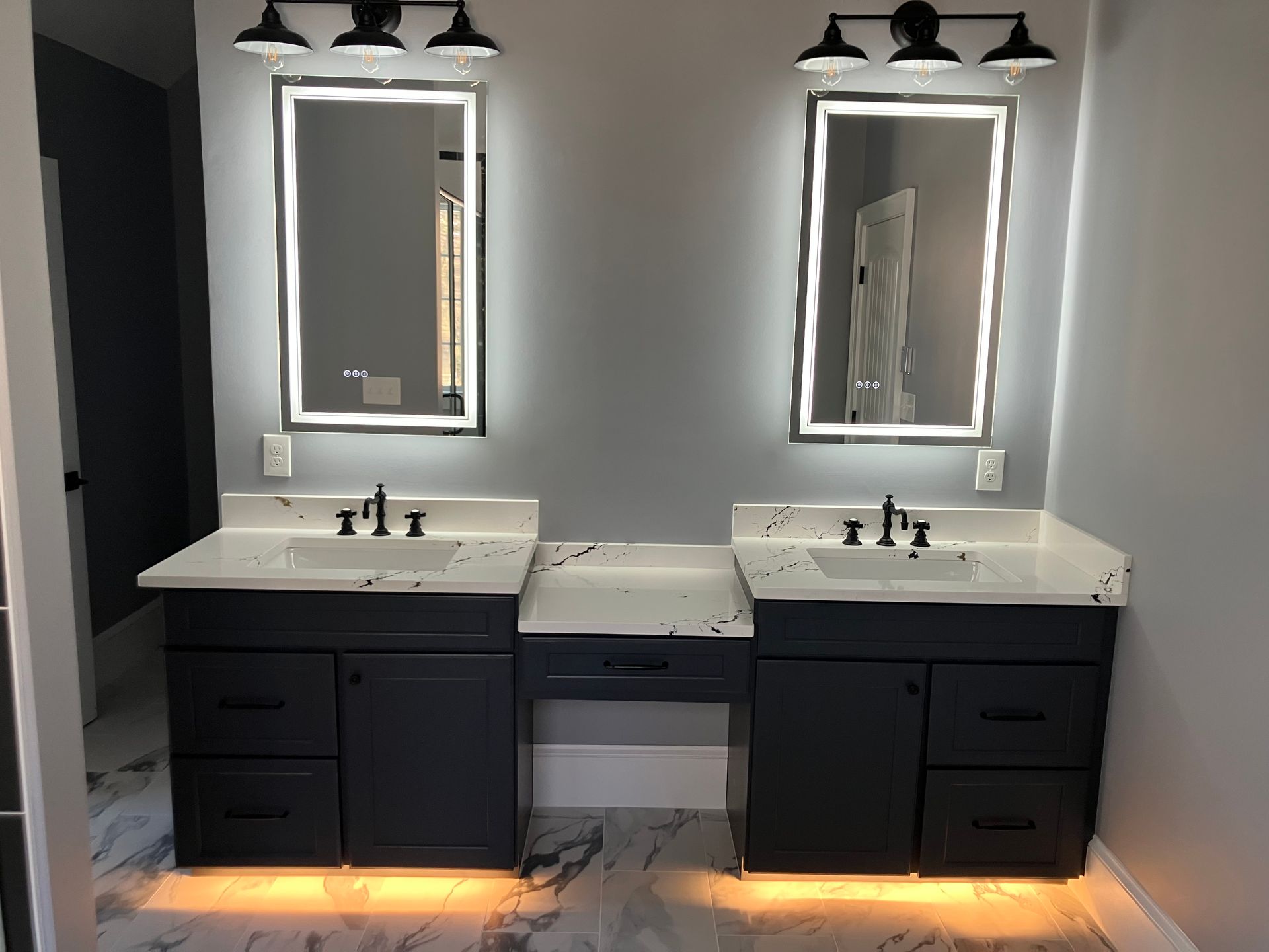 A bathroom with two sinks and two mirrors.