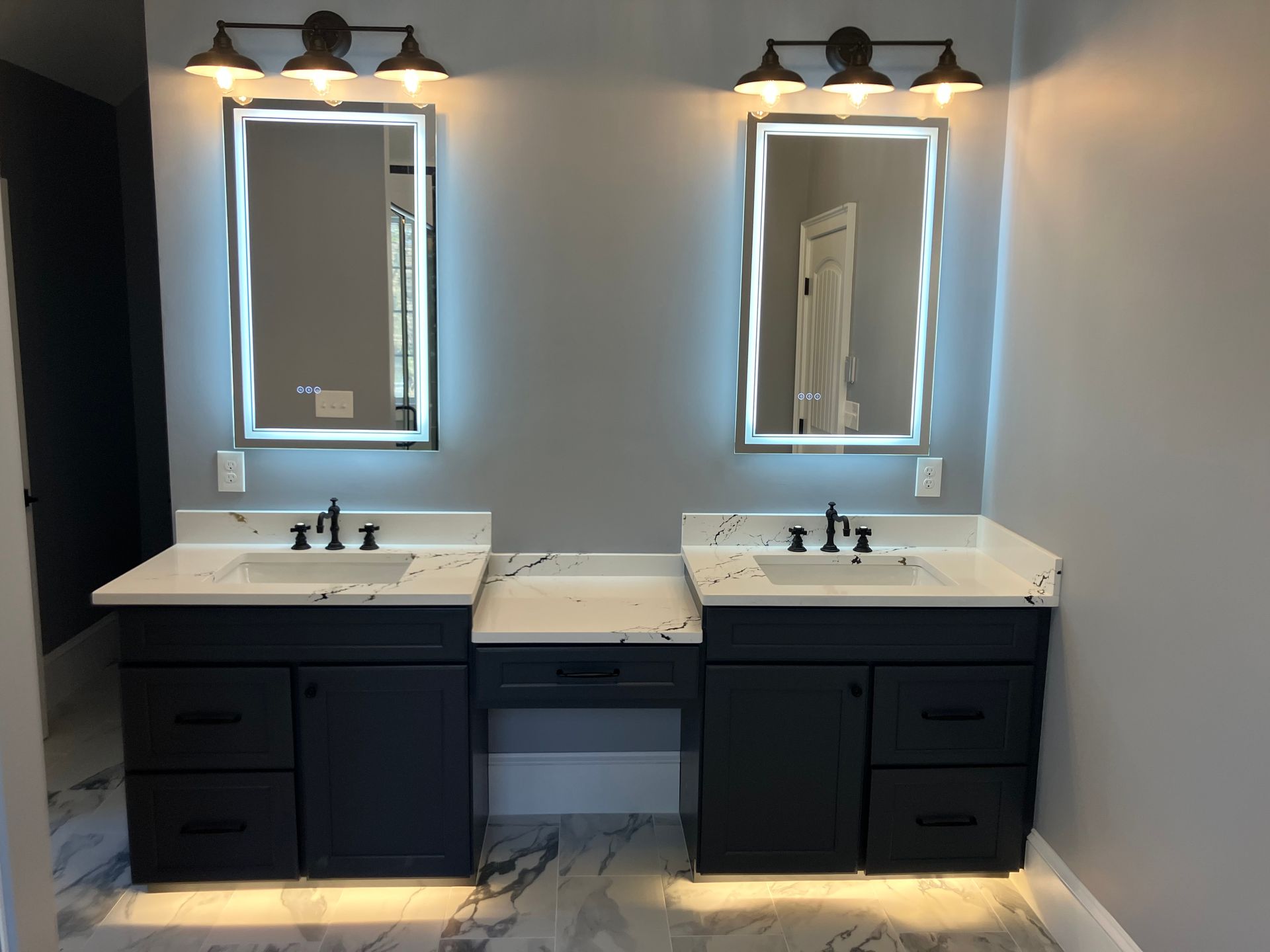 A bathroom with two sinks and two mirrors.