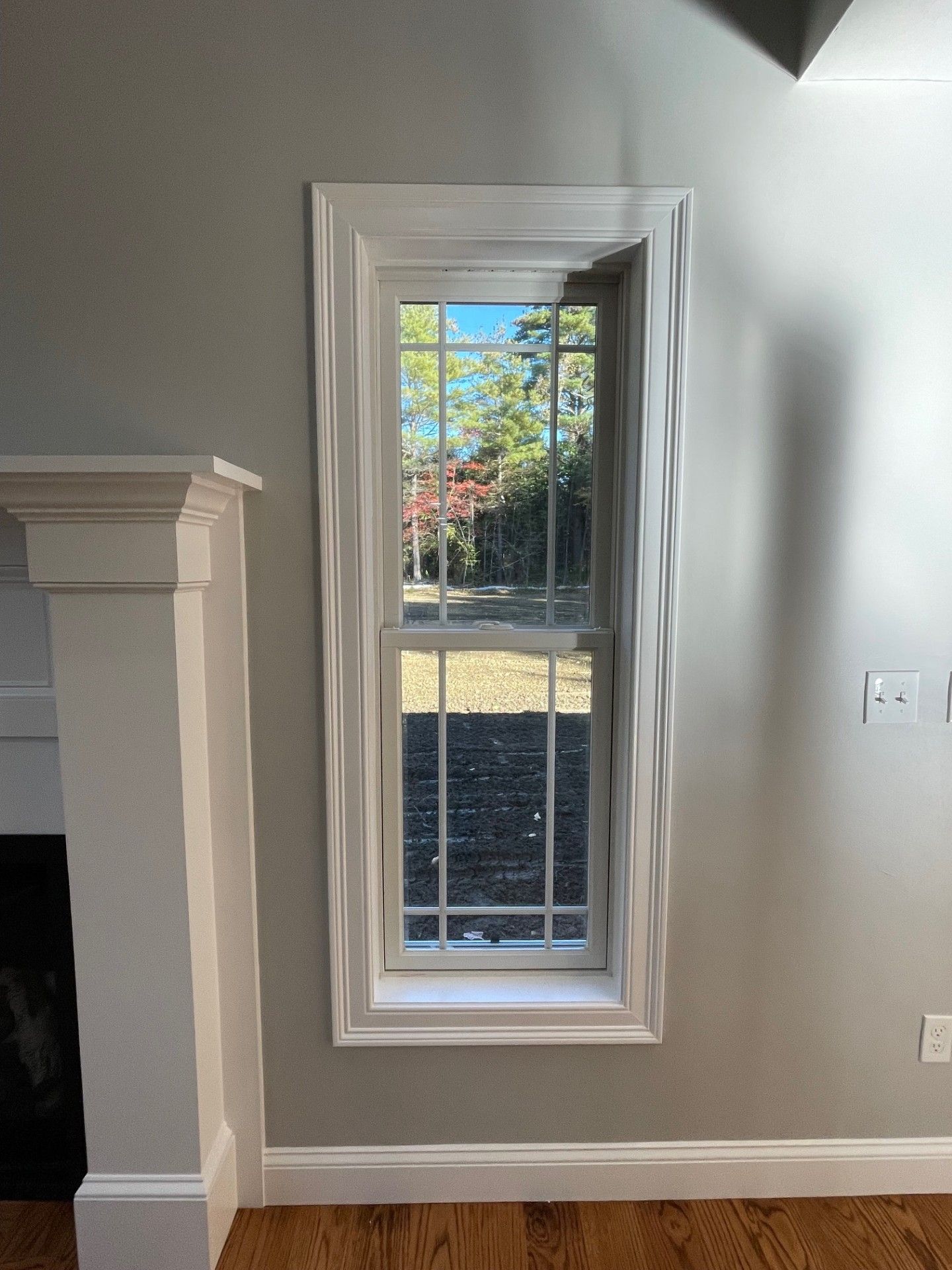 There is a window in the corner of the room.