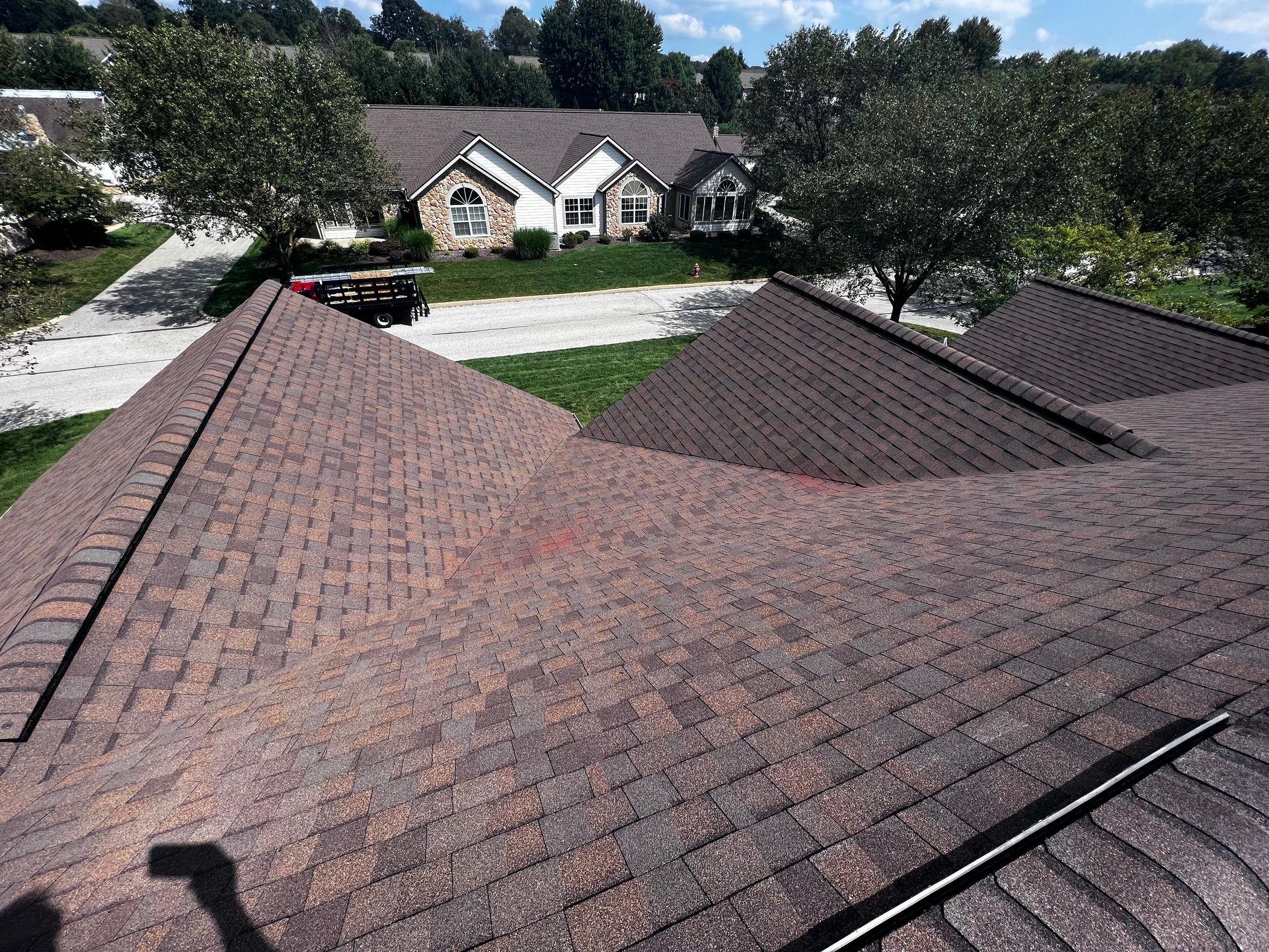 A roof of a house with a lot of shingles on it.