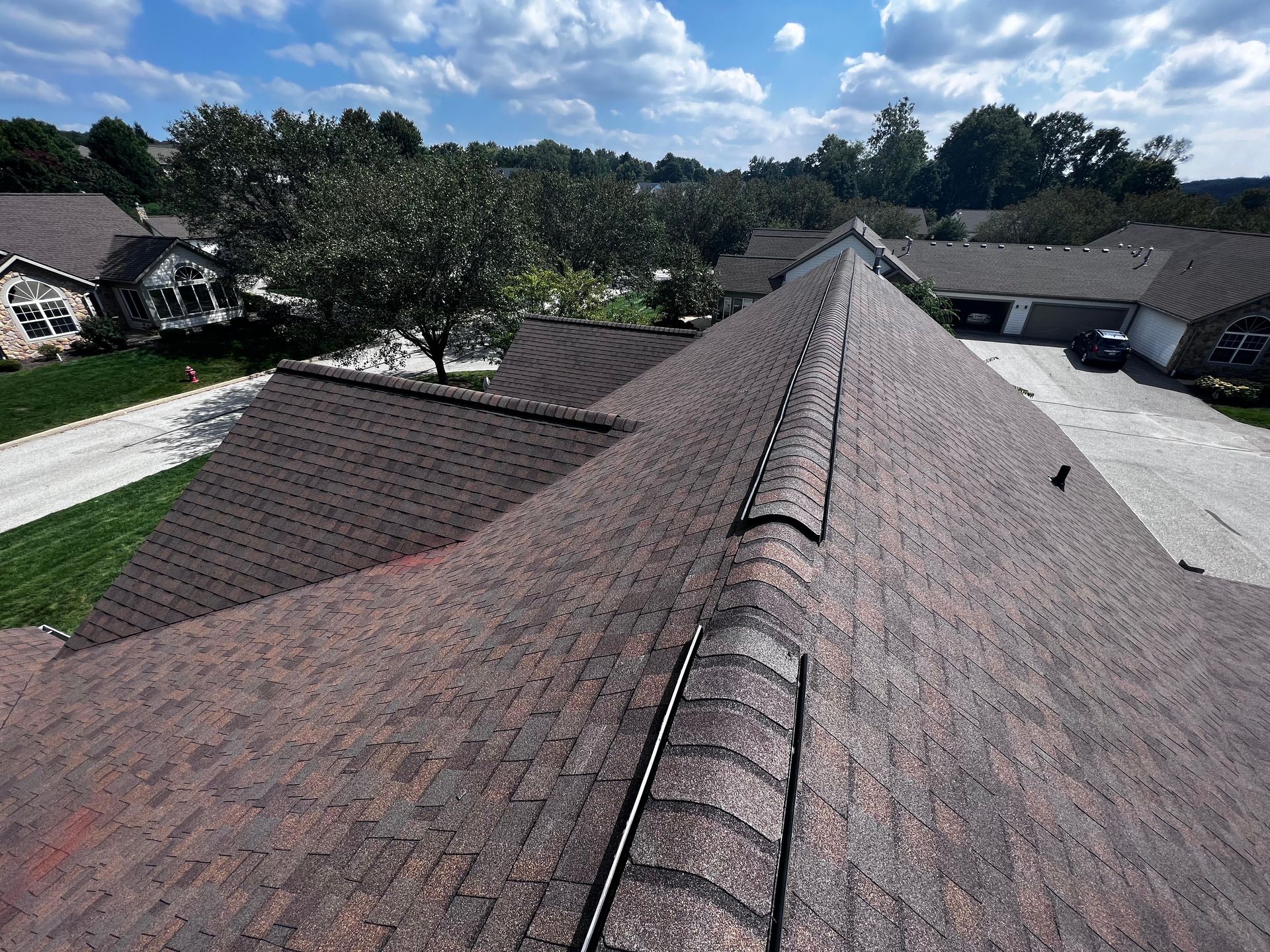 An aerial view of a roof with a ladder attached to it.