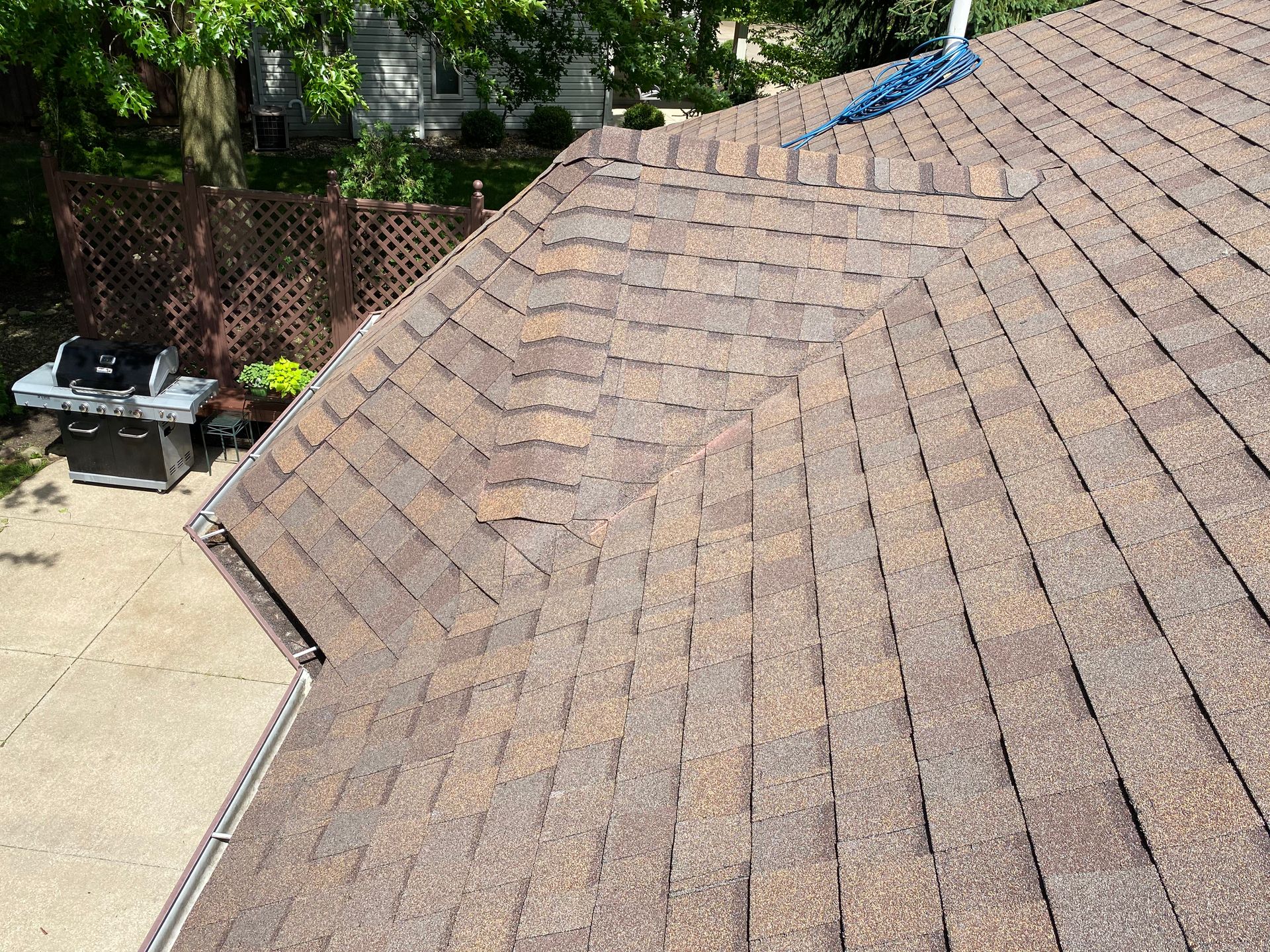 An aerial view of a roof with shingles on it.