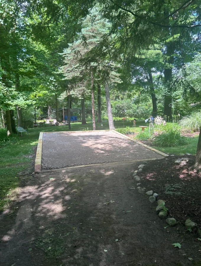 A dirt road in the middle of a forest
