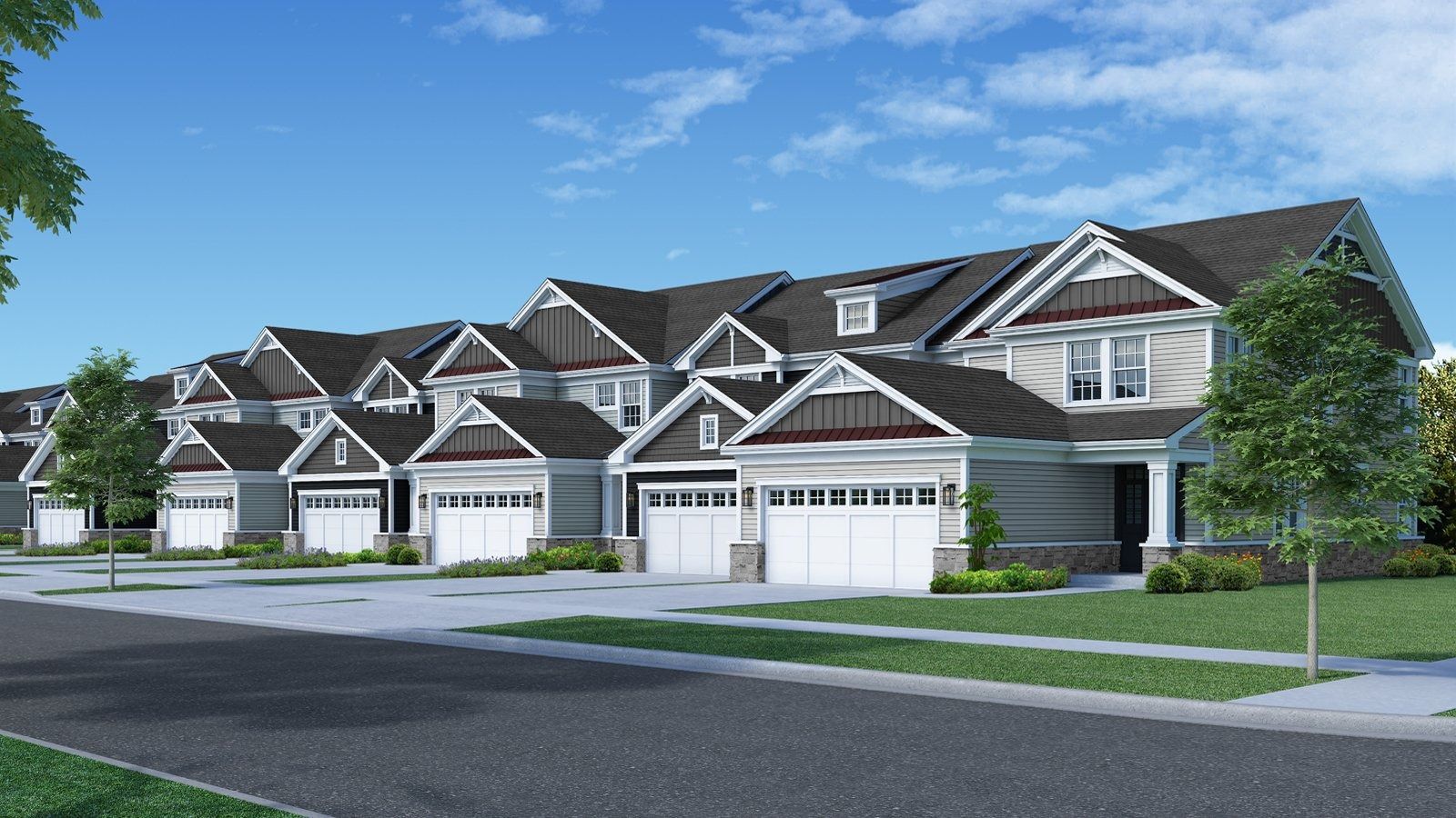 Row of modern suburban townhouses with attached garages and manicured lawns under a blue sky