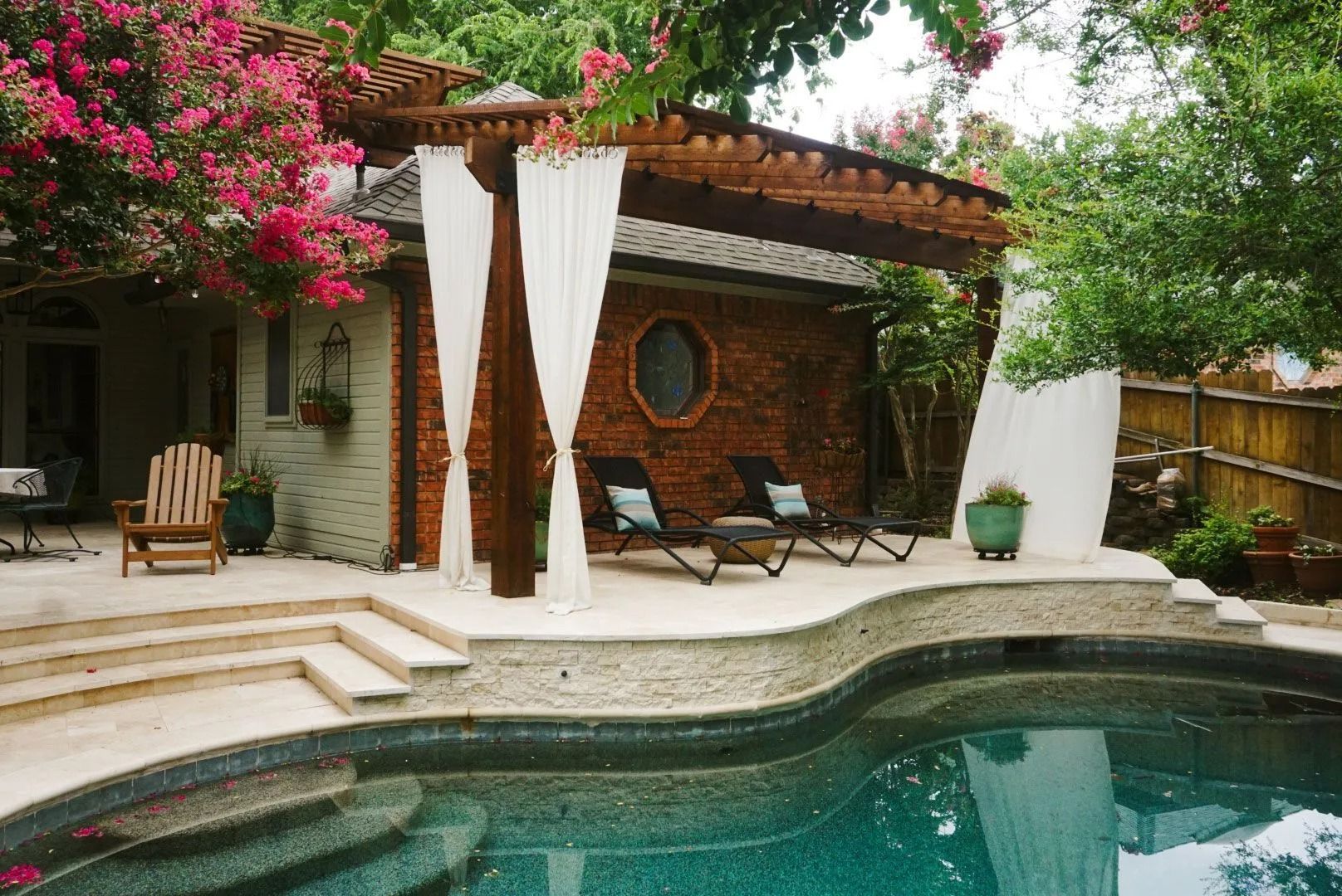 Backyard pool with stone patio
