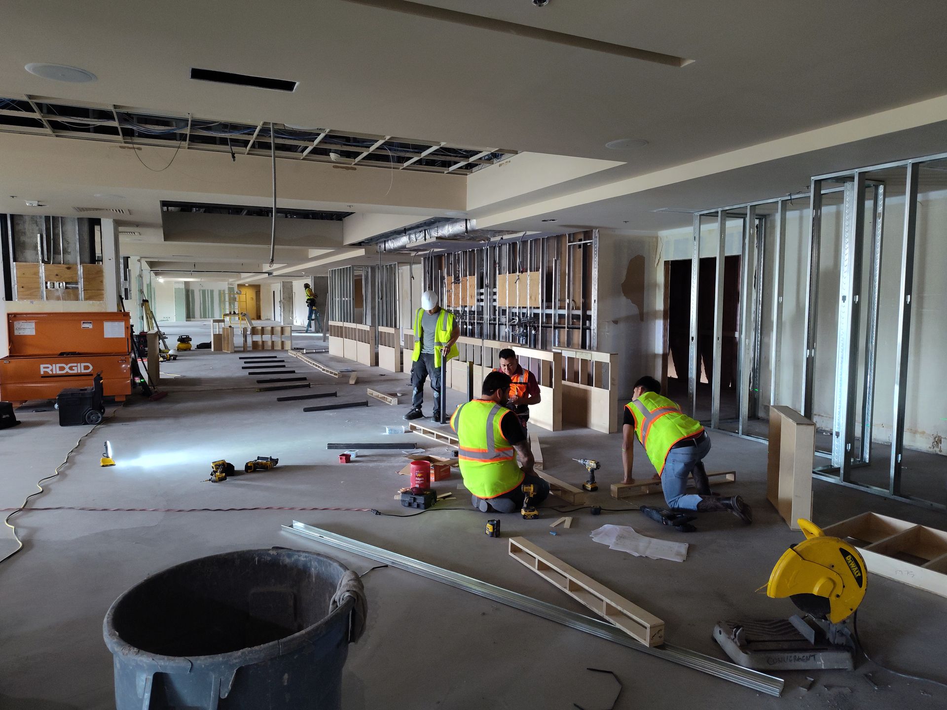 A group of construction workers are working on a building.