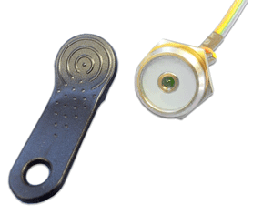 A key fob-like device and a circular port with a wire, likely for data transmission.