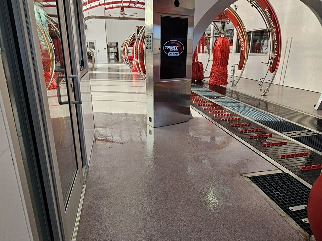 A hallway with a conveyor belt in the middle of it.