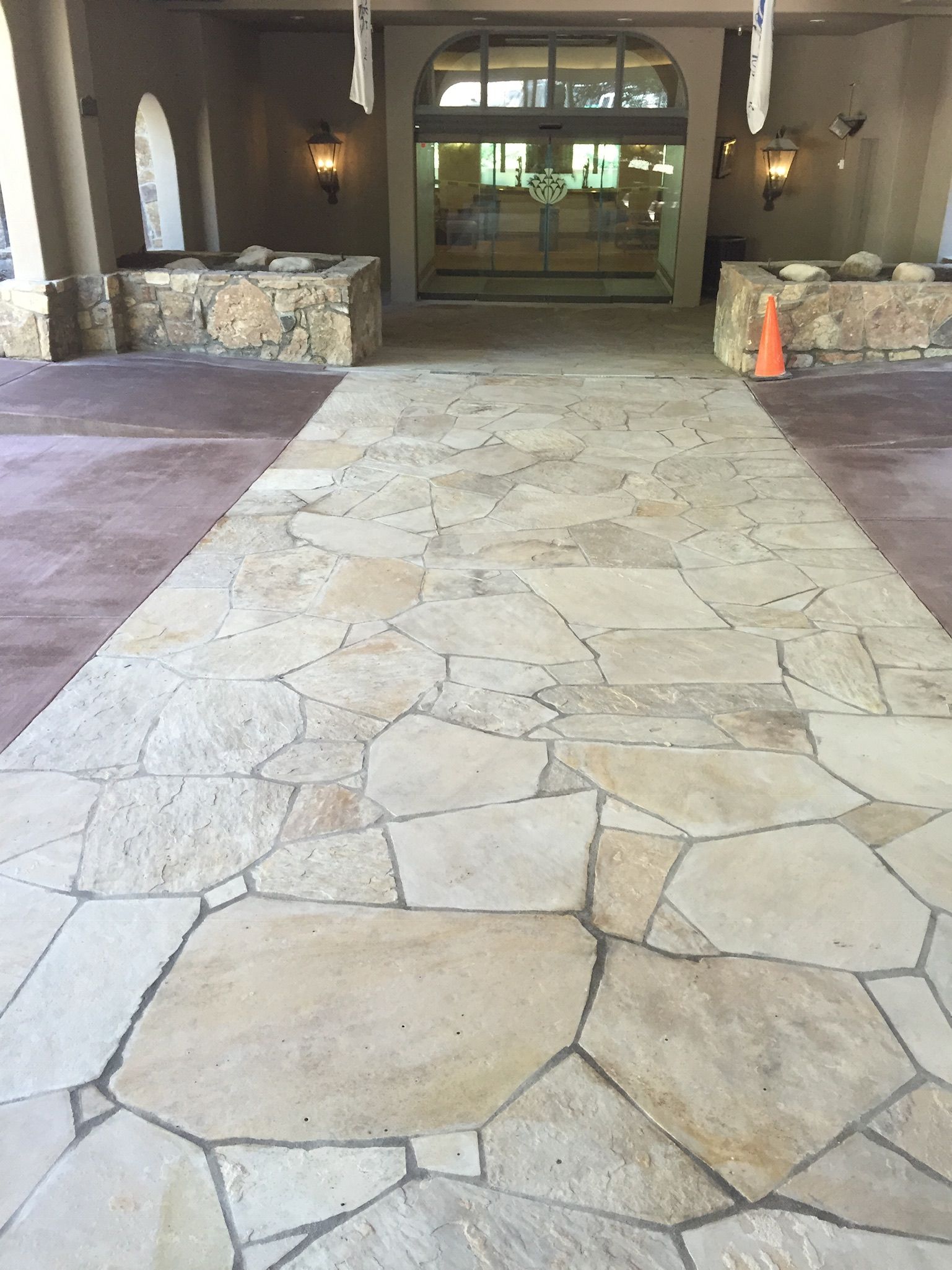 A stone walkway leading to the entrance of a building.