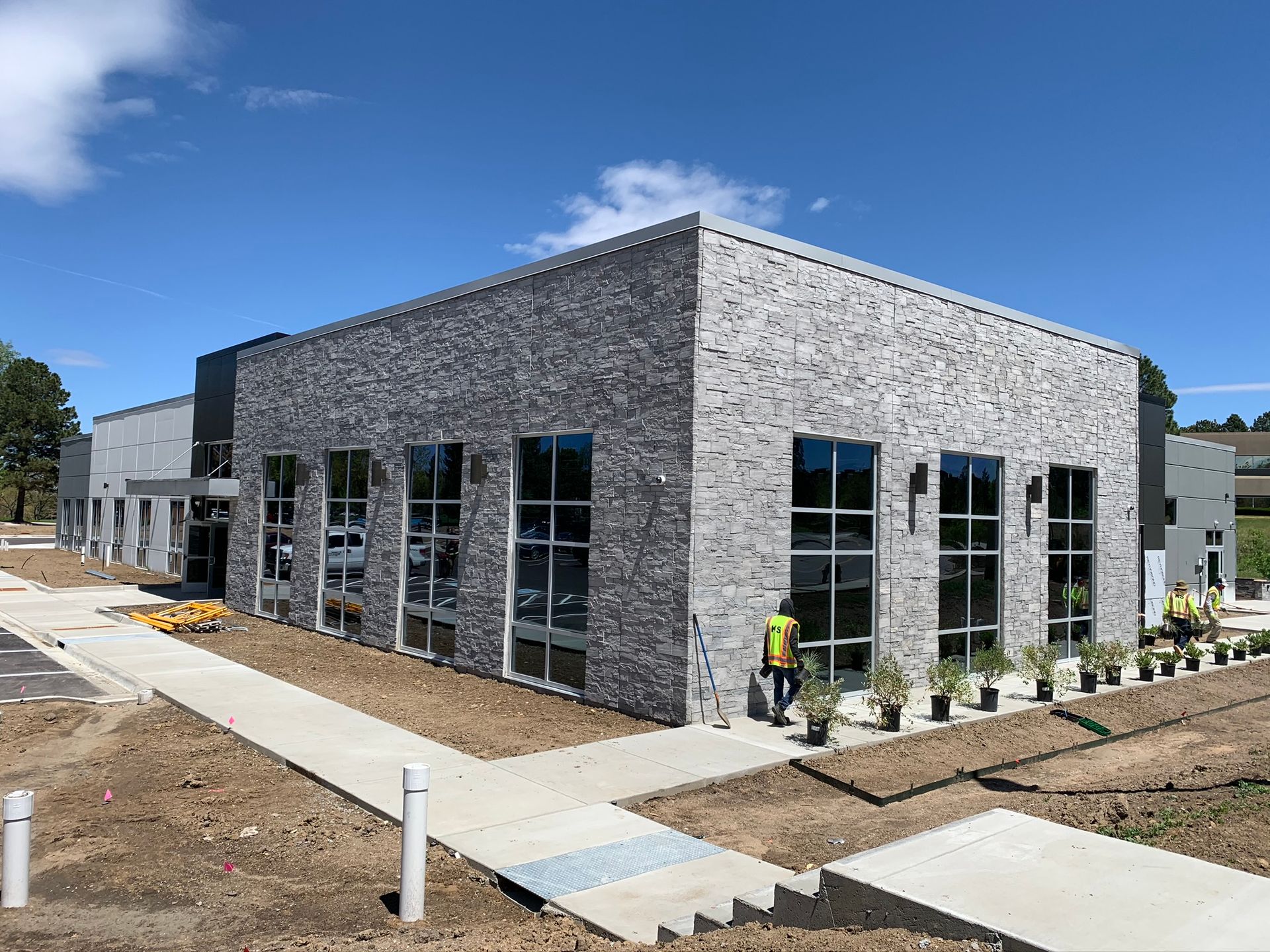 A large building with a lot of windows is being built.