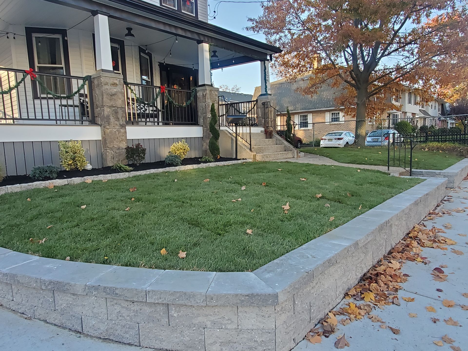 A house with a large lawn in front of it